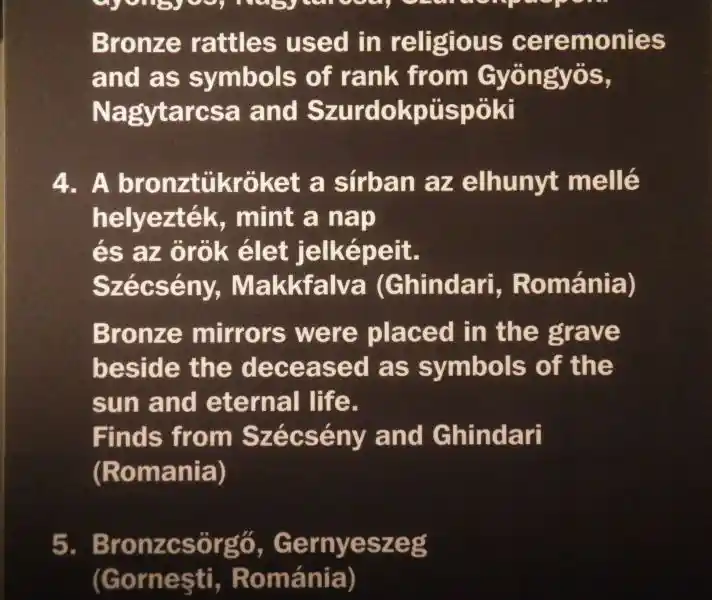 Bronze mirror, a solar symbol with an animal on the handle